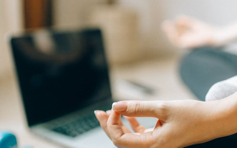 A serene and spacious room with a yoga mat on the floor.